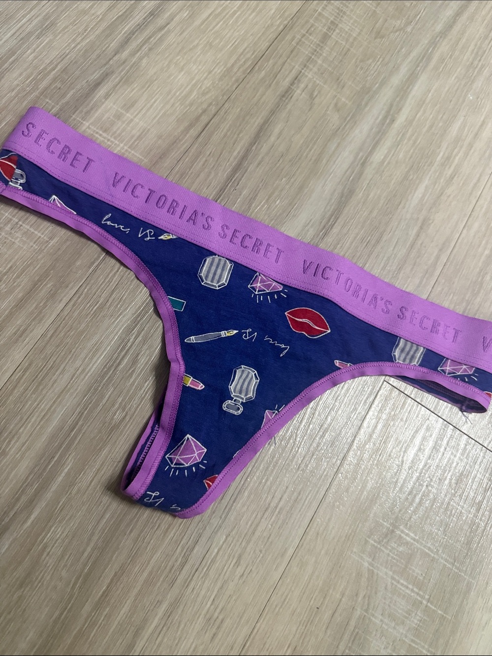 Victoria's Secret Navy Thong with Pink Trim and Cosmetic Print